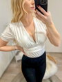Luxus női body fehér színben kivágással